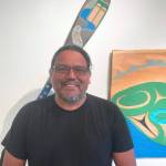 Photo courtesy of Port Angeles Fine Arts Center
Featured artist Darrell Charles stands in front of his artwork in the Beauty and Resilience exhibit at the Port Angeles Fine Arts Center. The center hosts a Second Saturday Art Walk from 3-6 p.m. on Aug. 10 at 1203 E. Lauridsen Blvd., Port Angeles.