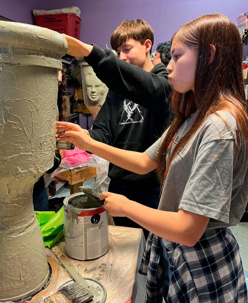 Photo courtesy Olympic Theatre Arts/ Stage manager Phoenix Whitaker and assistant stage manager Penny Medlong work on a set piece for The Secret Garden.