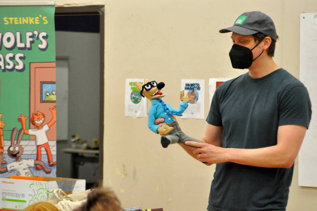 Sequim Gazette photo by Matthew Nash/ Cartoonist Aron Nels Steinke hold a puppet he made of his Mr. Wolf character thats modeled after him and his time as a teacher.