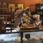Sequim Gazette photo by Matthew Nash/ Co-owner Jonel Lyons looks over items to place out for sale at the Carlsborg Store. She curates various vintage and professionally handmade items.