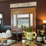 Sequim Gazette photo by Matthew Nash/ The Carlsborg Store features the original train depot sign along with daily organic tea tastings.
