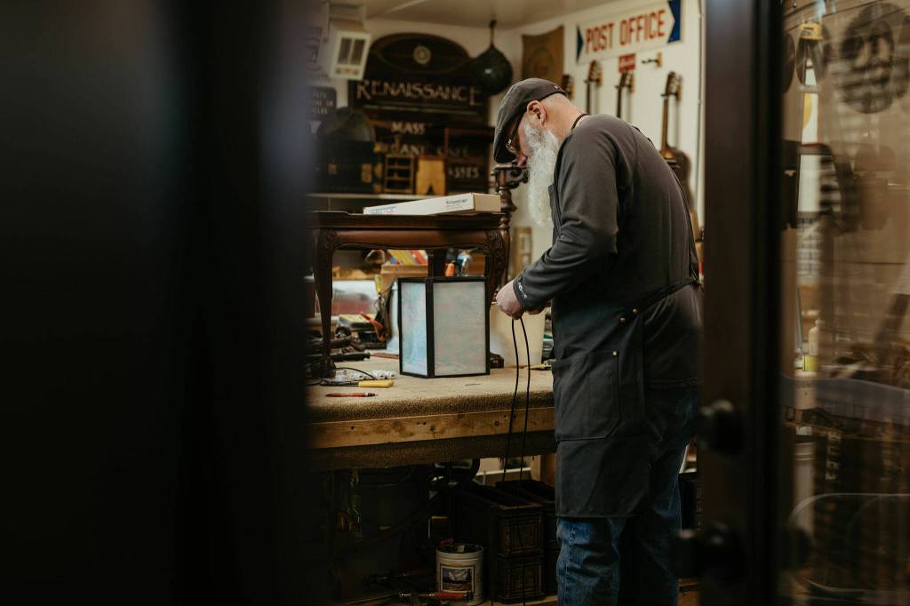 Photo courtesy Alyssa Teuton/ Justin Pollak uses his experience in woodworking to help customers restore family heirlooms and furniture at the Carlsborg Store.