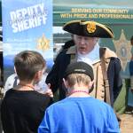 Sequim Gazette photo by Michael Dashiell / George Washington (Very Frykholm of Sequim) speaks with youths attending the Unity of Effort event in Aug. 10.