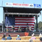 Sequim Gazette photo by Michael Dashiell / Evergreen Rock (U.S. Army) kicks off the live music at the Unity of Effort event in Sequim on Aug. 10.