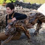 Photo courtesy of Molly Omann / Driftwood artist Molly Omann, poses with her life-sized cougar sculpture, which will be on display at Sequim Museum & Arts in April and during the First Friday Art Walk.