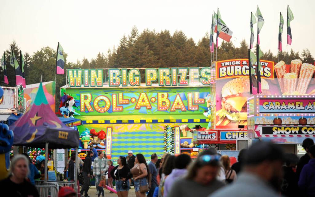 Sequim Gazette file photo by Michael Dashiell / Crowds pack the carnival at the Clallam County Fair in 2023.