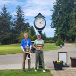 Photo courtesy of The Cedars at Dungeness / Jeff Jones, left, and Rick Towery celebrate division wins at the The Cedars at Dungeness Mens Club championship on Aug. 17. With a two-day score of 141 (3-under par), Jones won the club title for the fourth consecutive season, edging out Ron Grant; they were tied after 31 holes but Jones took the lead on hole No. 14 and held on. He will be heading to Georgia in March for the event with other club champions from around the U.S. Towery edged out Harry Phillips for the net division title, shooting a 71 gross for a net 59.