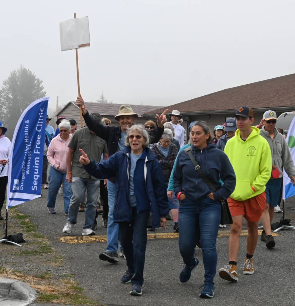 Sequim Gazette photo by Michael Dashiell / Participants in the Dungeness Valley Health & Wellness Clinics 17th Fun Walk and Health Fair make their way from Trinity United Methodist Church into Carrie Blake Community Park on Aug. 10. The event is the clinics sole fundraiser and includes 1-mile and 5k options.