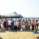U.S. Rep. Derek Kilmer, D-Gig Harbor, and members of the North Olympic Peninsula Recompete Coalition stand together following a press conference at Harborview Park on Friday in Port Angeles. (Christopher Urquia/Peninsula Daily News)