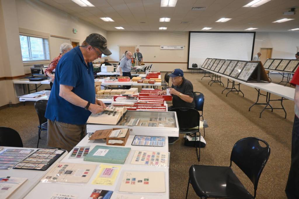 Sequim Gazette photo by Michael Dashiell / Visitors enjoy the 2024 Strait Stamp Show at the Guy Cole Event Center on Aug. 10.