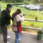 Photos courtesy of Sequim Museum & Arts
Matt Dryke, gold medal winner in skeet shooting at the 1984 Olympic Games, instructs Sequim teen Danika Chen at Sunnydell Shooting Grounds in June. Hes still giving shooting lessons and showings at 66, Chen said. He says the trick is to follow the target with your eyes and the gun will follow.