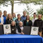 Photo by Jackie Johnson/Jamestown SKlallam Tribe
Martha Williams, director of the U.S. Fish & Wildlife Service, and Ron Allen, CEO and Tribal Chairman of the Jamestown SKlallam Tribe (both seated), celebrate the signing of a co-stewardship agreement for the Dungeness and Protection Island National Wildlife Refuges on Aug. 16.