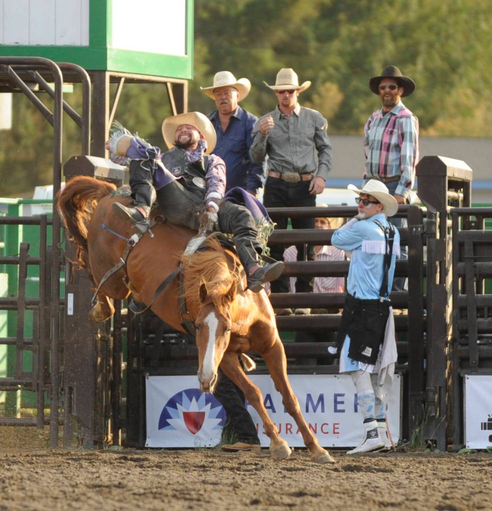 Sequim Gazette photo by Michael Dashiell / Chache Hill of St. Anthony, Idaho, holds on for a big score in the bareback riding competition at the Clallam County Fair Rodeo on Aug. 16. Hill tied for second palce.