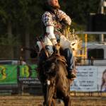 Sequim Gazette photo by Michael Dashiell / Despite nursing an injury, Kyle Bounds of Harrisburg, Oregon, holds on for a big score in the bareback riding portion of the Clallam County Fair Rodeo on Aug. 16. Bounds took first in the division.