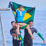Brazilian teammates carry Tatiana Weston-Webb from the competition after a silver medal performance at the 2024 Olympic Games in Tahiti in early August.