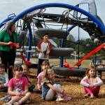 Sequim Gazette photo by Matthew Nash/ Ocean Mounts cuts the ribbon for Greywolf Elementarys Quantis M2 playground equipment on Aug. 16. He asked about the school getting a new playground a few years ago, which served as inspiration for school and PTA leaders, said principal Jennifer Lopez.