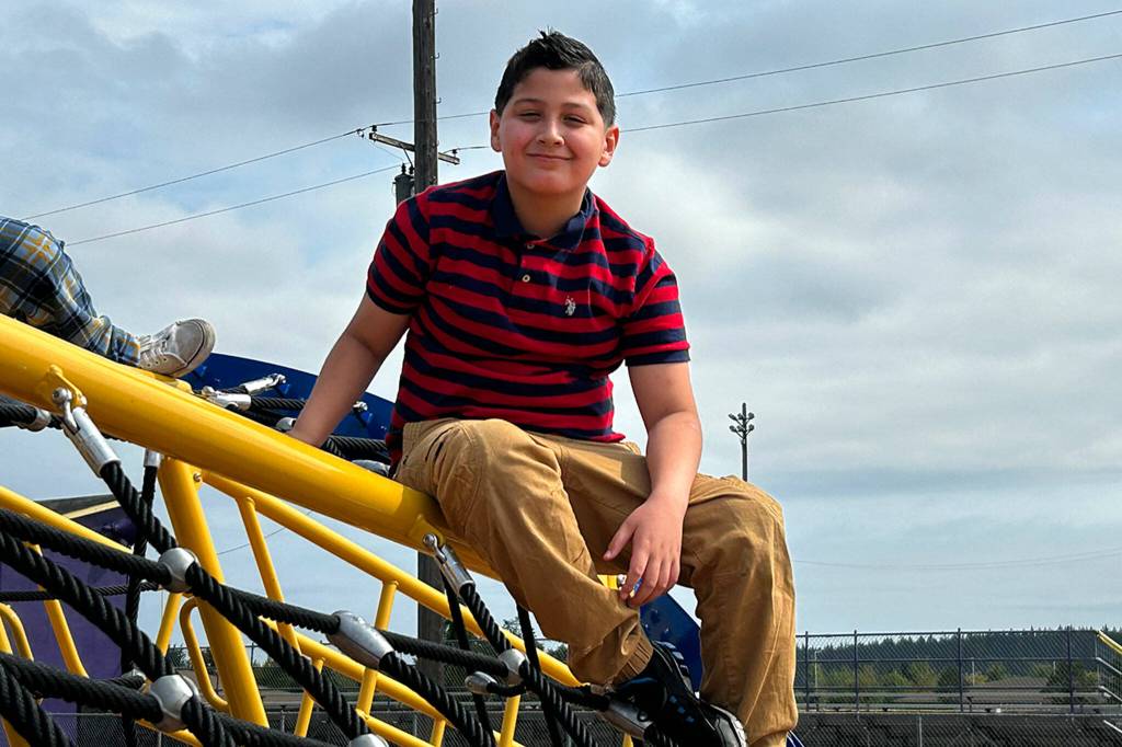 Julian Mendoza, a fourth-grader at Helen Haller Elementary, said he was honored to cut the ribbon for the schools new playground. He was the first to learn of the structure after principal Rebecca Stanton showed him a picture of it.
