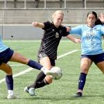 Photo by Rick Ross/Peninsula College Athletics
Peninsula Colleges Anna Petty, center, dribbles between Columbia Basins Olivia Mendoza and Julissa Caceres during the Pirates 3-0 win over the Hawks at the NWAC Friendlies in Tukwila in mid-August.