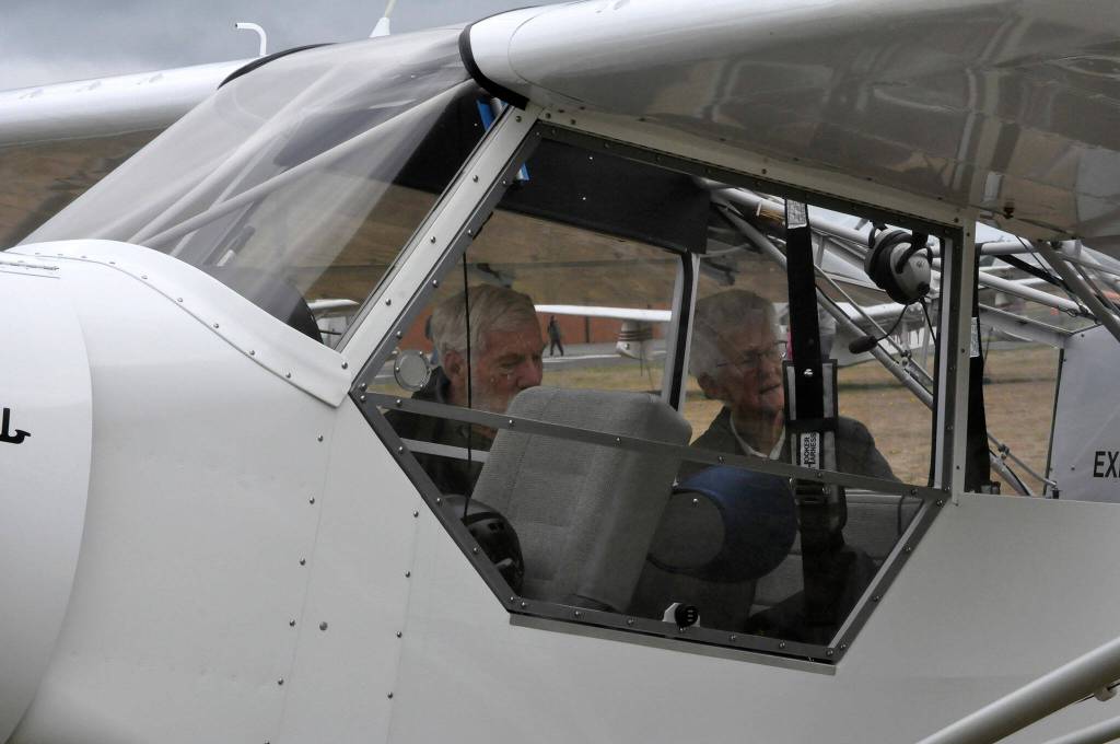 Sequim Gazette photo by Matthew Nash/ A couple looks at Ernie Hansens Experimental Super Cub out of Diamond Point on Aug. 24.