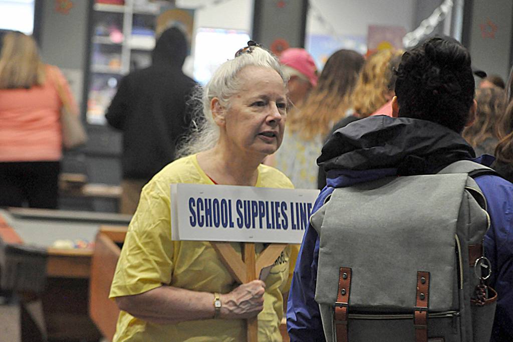 For the second year, Carol Rogers, a Sequim volunteer with the Bahai Faith, helps at the Back to School Fair in the Sequim Boys & Girls Club. She said volunteering is part of her faith in service to the community.