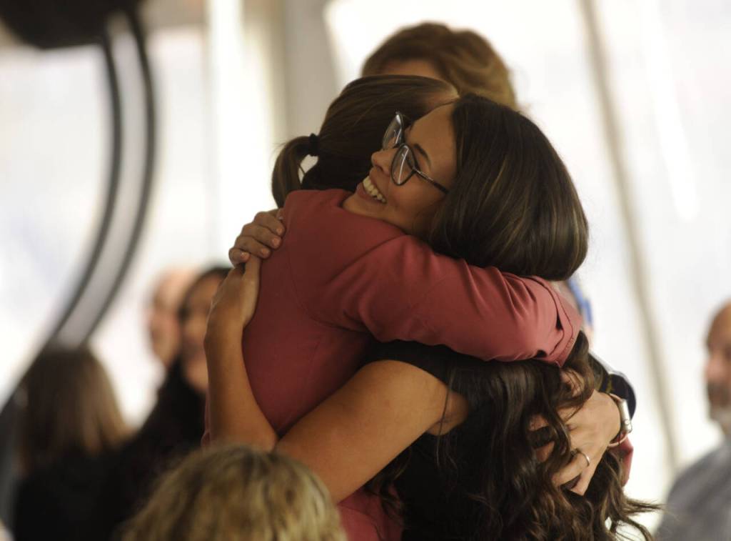Sequim Gazette photo by Michael Dashiell / Rylleigh Zbaraschuk, left, and Makayla Payne (Bentz) share a moment at the 2024 Sequim Athletic Hall of Fame event on Saturday. The pair were teammates on the undefeated 2011 fastpitch team that took the 2A title and earned SHSs first team sports title.