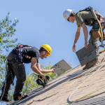 Photo courtesy of Sherrie Cerutti
BMC Roofing crew members place new shingles on Aug. 30 atop the Sequim Prairie Grange.