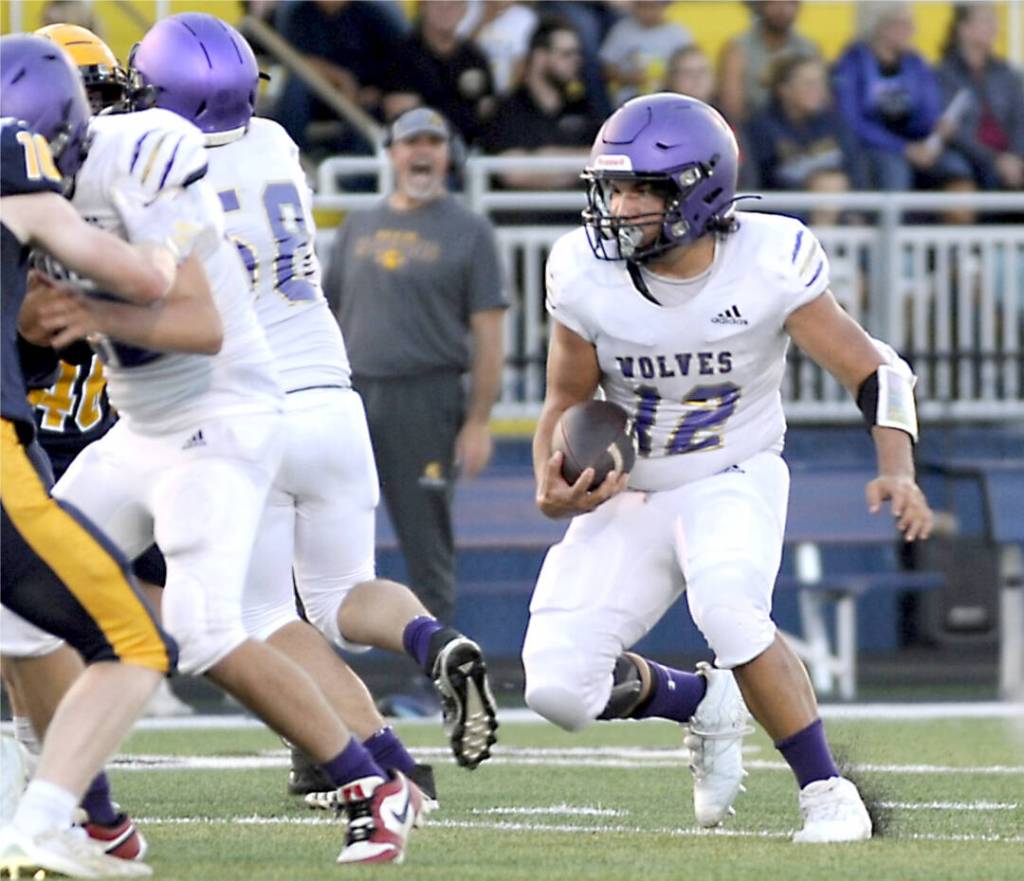 Sequims Liam Wiker (12) made the all-Olympic League second team as a running back in 2023, and returns this fall to anchor the Wolves backfield.