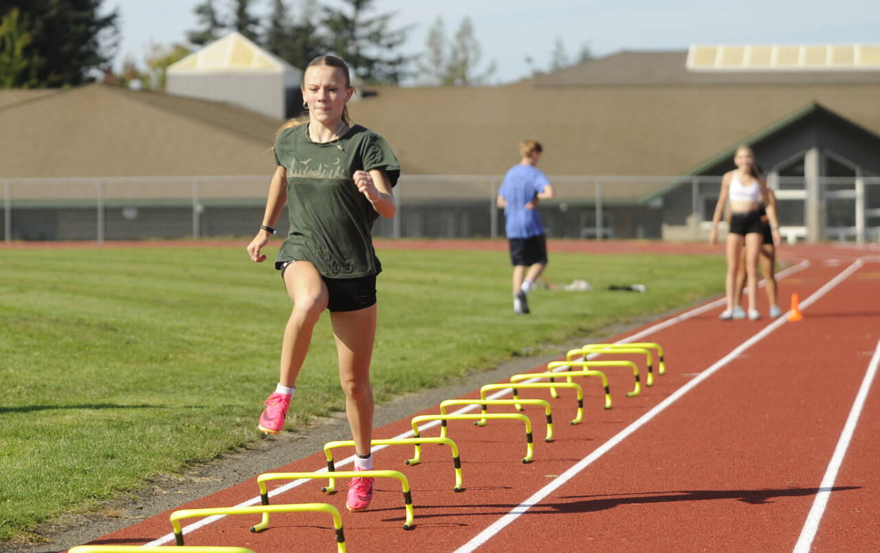 Sequim Gazette photo by Michael Dashiell / Sequims Bridgett (Birdie) Pyeatt gets a high-leg workout at the SHS track last week as she and cross country teammates prep for the 2024 season.