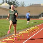 Sequim Gazette photo by Michael Dashiell / Sequims Bridgett (Birdie) Pyeatt gets a high-leg workout at the SHS track last week as she and cross country teammates prep for the 2024 season.