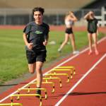 Sequim Gazette photo by Michael Dashiell / Sequims Jackson Hines gets a high-leg workout at the SHS track last week as he and cross country teammates prep for the 2024 season.
