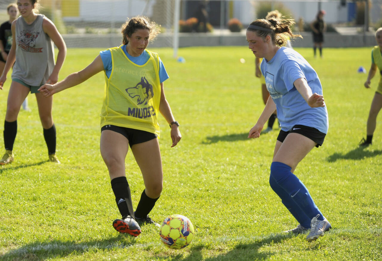 Sequim Gazette photos by Michael Dashiell
Sequim Highs Laila Sundin, left, and Libby Turella vie for possession in a preseason practice last week. The Wolves opened the 2024 campaign against Vashon on Sept. 10.