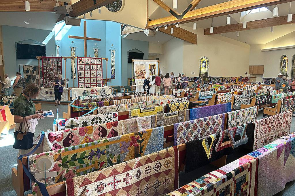 Sequim Gazette photo by Matthew Nash/ Quilts selected by the public for different categories at the Sunbonnet Sue Quilt Clubs show in July will on display through the end of October in A Stitch in Time Quilt Shoppe.