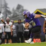 Sequim Gazette photo by Michael Dashiell / Sequims Liam Wiker looks to evade would-be Franklin Pierce tacklers the Wolves 36-14 loss to Franklin Pierce on Sept. 13.