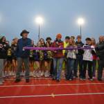 Sequim Gazette photo by Michael Dashiell / Sequim High sophomore Clare Turella does the honors, cutting a ceremonial ribbon to celebrate the Sequim School Districts newly-refurbished track on Sept. 13. Turella won a state 2A high jump title as a freshman in 2023.