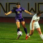 Sequim Gazette photo by Michael Dashiell / Sequim defender Harper Moore, left, snatches the ball from Bainbridges Izzi Pujolar in the first half of SHSs match-up with the Spartans on Sept. 19.
