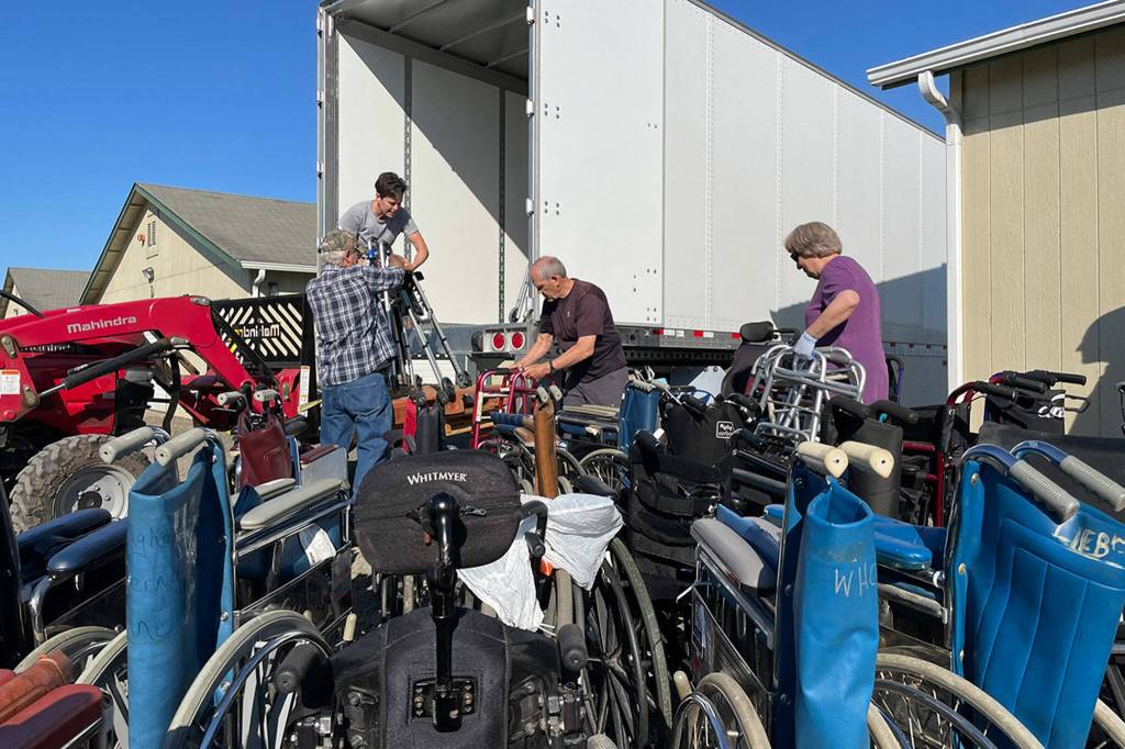 Sequim Gazette file photo by Matthew Nash
Dungeness Community Church volunteers load more than 500 wheelchairs, walkers, canes, crutches and walking sticks onto a tractor-trailer in September 2022 at All-Safe Mini Storage. Organizers worked nearly two years to gather and ship the supplies to Guatemala.