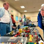 Sequim Gazette photo by Matthew Nash/ Nuna Bear of Sequim talks with toy vendor Dick Cays at the second Olympic Peninsula Toy and Collectibles Show on Sept. 14. She was looking for a Matchbox toy similar to her grandpas 1950s Ford truck. Event organizer Corey Edwards said the event was successful and they will bring back another show, possibly in the spring at the Guy Cole Event Center in Carrie Blake Community Park. To learn more, visit <a href="https://facebook.com/groups/peninsulatoyshow" target="_blank">facebook.com/groups/peninsulatoyshow</a>.