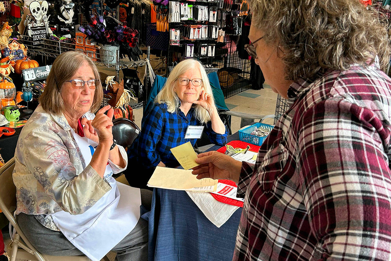 Sequim Gazette photo by Matthew Nash
Volunteers Barbara VanderWerf and Maren Halverson with the League of Women Voters of Clallam County speak with a customer at Sequim Goodwill about ballot information on Sept. 17 during an information session held in conjunction with the stores in Sequim and Port Angeles on National Voter Registration Day.