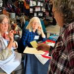 Sequim Gazette photo by Matthew Nash
Volunteers Barbara VanderWerf and Maren Halverson with the League of Women Voters of Clallam County speak with a customer at Sequim Goodwill about ballot information on Sept. 17 during an information session held in conjunction with the stores in Sequim and Port Angeles on National Voter Registration Day.