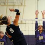 Sequim Gazette photo by Michael Dashiell / Sequims Kenzi Berglund, left, and Arianna Stovall look to block Bainbridges Holley McFadden in an Olympic League match in Sequim on Sept. 19.