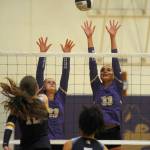 Sequim Gazette photo by Michael Dashiell
Sequims Kenzi Berglund, left, and Arianna Stovall look to block Bainbridges Elsa Wetzler in an Olympic League match in Sequim on Sept. 19.