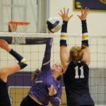 Sequim Gazette photo by Michael Dashiell / Sequims Brianna Palenik, center, looks to hit past Bainbridge blockers Carmen MacCulloch (13) and Rollins Anderson in an Olympic League match in Sequim on Sept. 19.