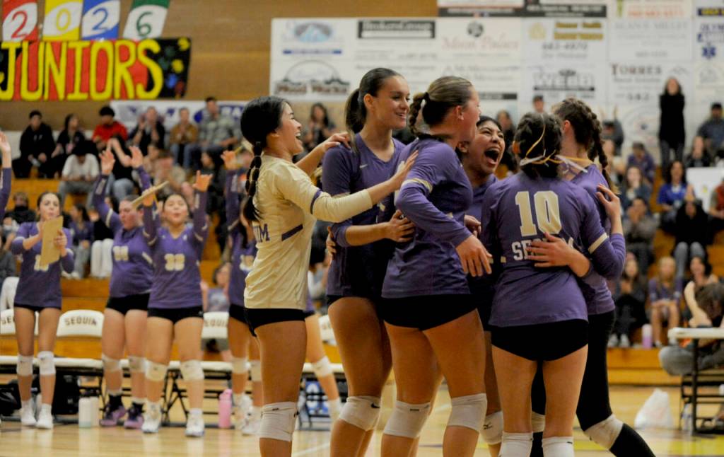 Sequim Gazette photo by Michael Dashiell / Sequim players celebrate after getting a point in a Sept. 19 home match against Bainbridge in Set. 19.