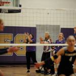 Sequim Gazette photo by Michael Dashiell / Sequim coaches celebrate a key point in the third set of a league match against Bainbridge on Sept. 19.