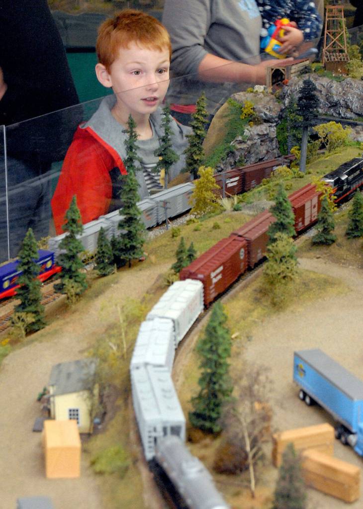 Keith Thorpe, Olympic Peninsula News Group/ In 2019, Liam Camntu marvels at a model railroad setup at the North Olympic Peninsula Railroaders train show held at the Clallam County Fairgrounds. The free event returns to the Sequim Prairie Grange this weekend after a few years away.