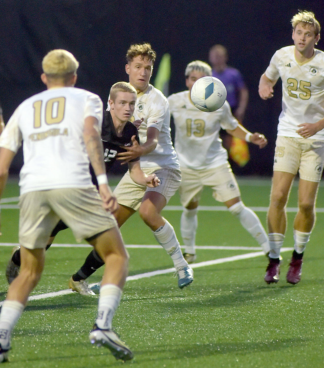 Photo by Keith Thorpe/Olympic Peninsula News Group / Everetts Lunden Fenster, second from left, eyes a loose ball surrounded by Peninsulas (from left) Nil Grau, Konrad Mueller, Ezrrah Ochoa, and Sid Gunton-Day on Sept. 18 in Port Angeles.
