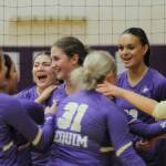 Sequim Gazette photo by Michael Dashiell / Sequim Highs volleyball squad celebrates a three-set win over Port Angeles on Sept. 26.
