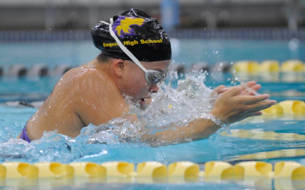 Sequim Gazette photo by Michael Dashiell / Sequims Annie Ellefson vies for a top time in the 100 breaststroke against Port Angeles in a Sept. 25 Olympic League meet in Sequim.