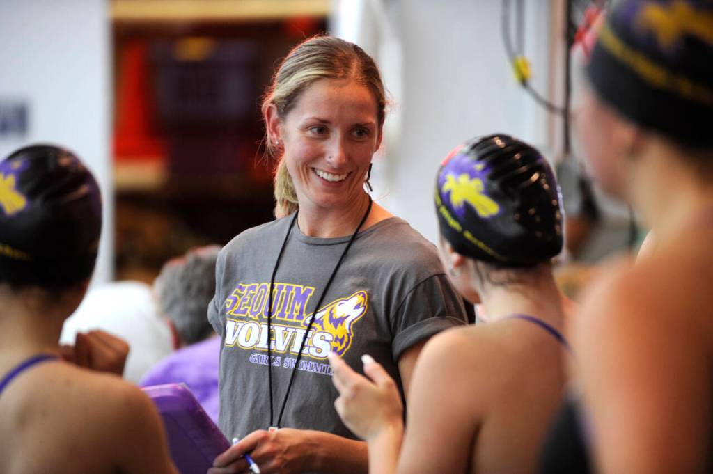 Sequim Gazette photo by Michael Dashiell / Sequim co-head coach Sarah Thorson talks with her swimmers during a Sept. 25 home meet against Port Angeles.