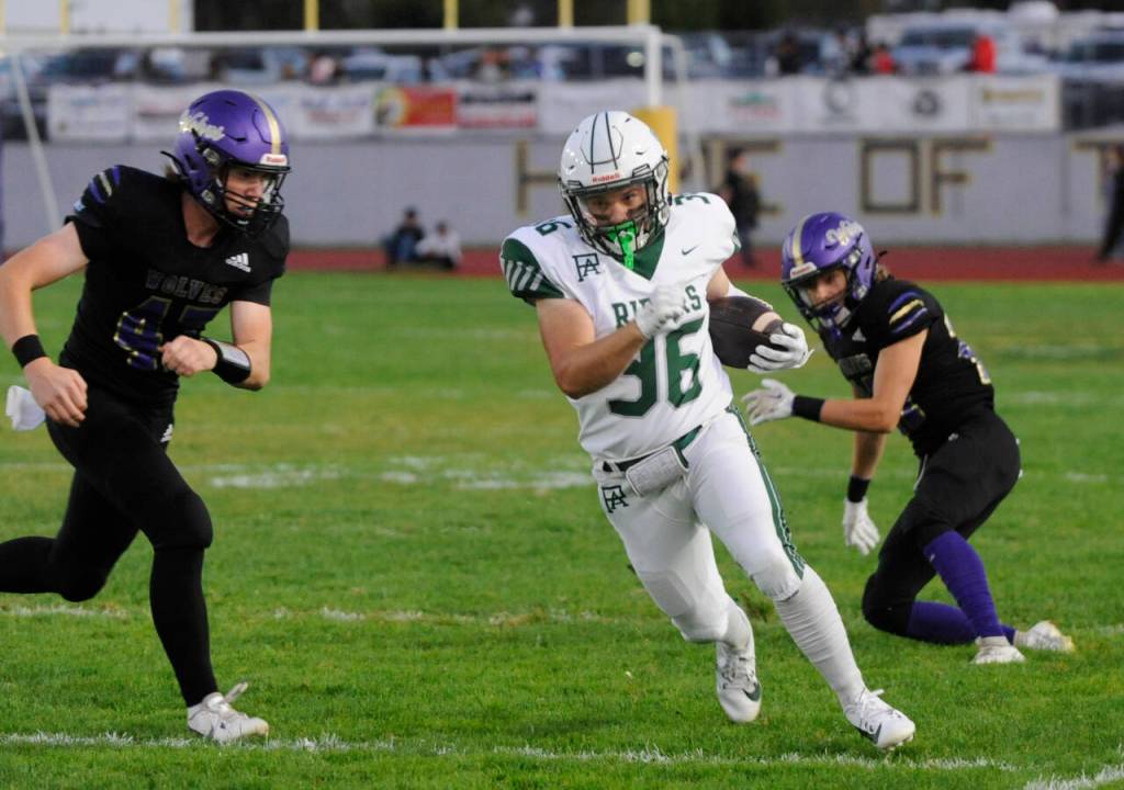 Sequim Gazette photo by Michael Dashiell / Port Angeles running back Braydon Wopperer looks for yardage in the openign quarter of an Olympic League match-up on Sept. 27 at Sequim.
